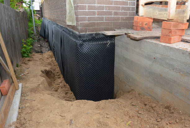 Happy homeowners after waterproofing job in Walnut Grove